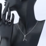 عقد فضة مع خاتم  حرف نسائي عيار 925